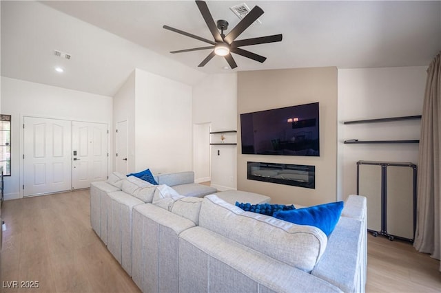 2548 Tumble Brook Dr, Las Vegas, NV 89134 - living area featuring a ceiling fan, light wood finished floors, lofted ceiling, and recessed lighting