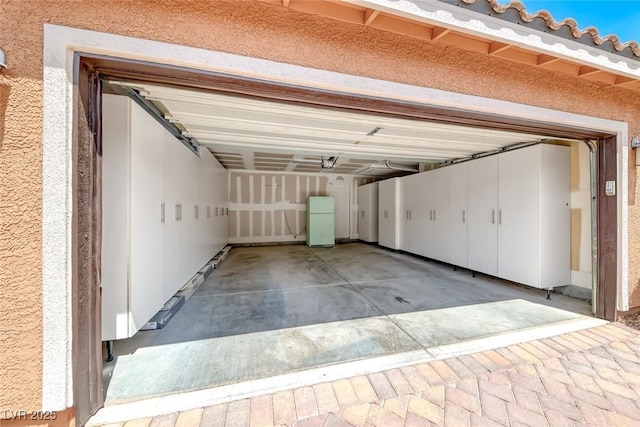 2337 Via Barranca St, Henderson, NV 89044 - garage featuring freestanding refrigerator and driveway