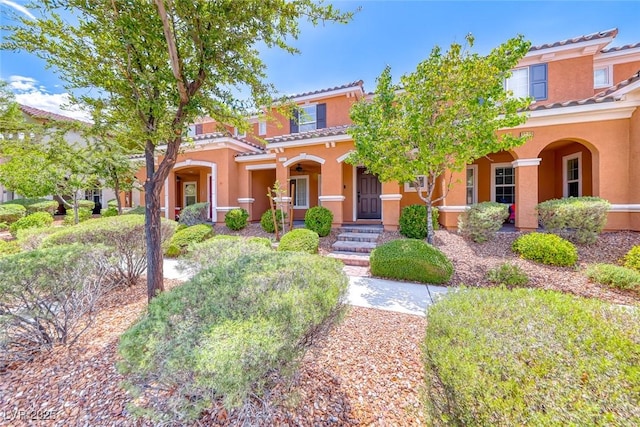 2337 Via Barranca St, Henderson, NV 89044 - mediterranean / spanish-style house featuring a porch, stucco siding, and a tile roof