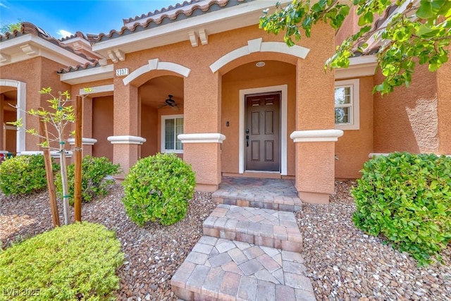 2337 Via Barranca St, Henderson, NV 89044 - doorway to property with stucco siding, a tiled roof, and a ceiling fan
