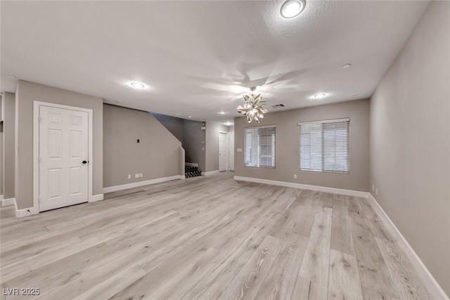 2337 Via Barranca St, Henderson, NV 89044 - unfurnished living room with a chandelier, light wood-type flooring, and recessed lighting