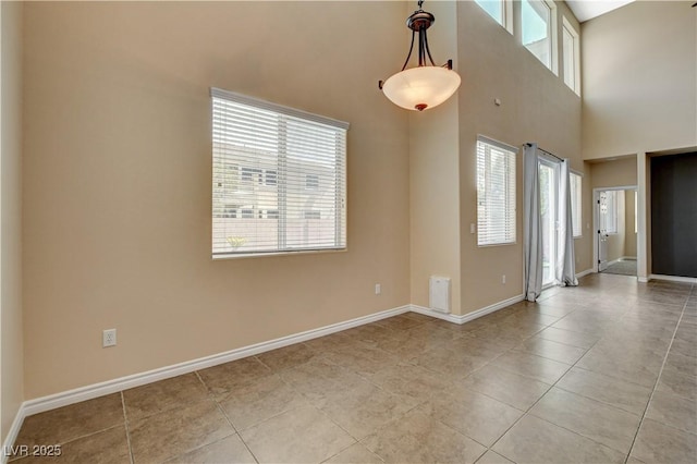 4208 Falcons Flight Ave, North Las Vegas, NV 89084 - empty room featuring light tile patterned floors and a towering ceiling