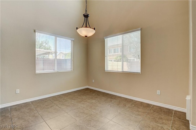 4208 Falcons Flight Ave, North Las Vegas, NV 89084 - unfurnished room with plenty of natural light and light tile patterned flooring