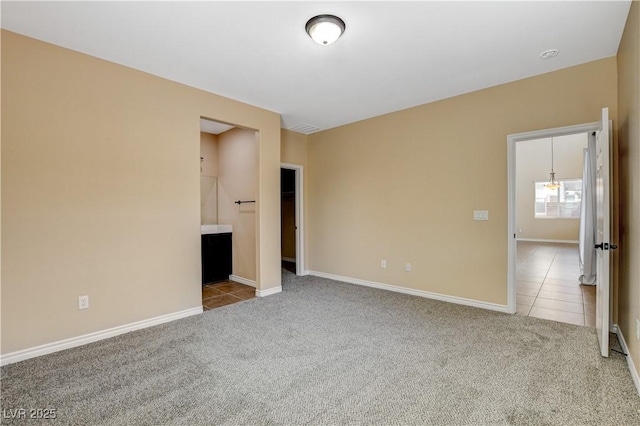 4208 Falcons Flight Ave, North Las Vegas, NV 89084 - carpeted spare room featuring tile patterned flooring and baseboards