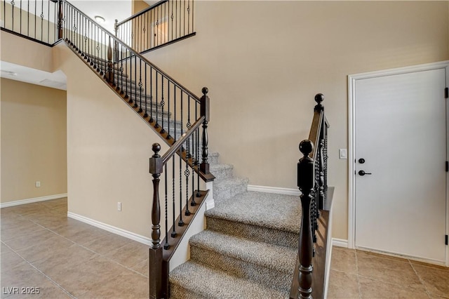 4208 Falcons Flight Ave, North Las Vegas, NV 89084 - staircase featuring tile patterned flooring and baseboards