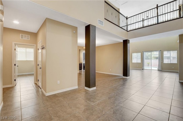 4208 Falcons Flight Ave, North Las Vegas, NV 89084 - unfurnished living room with tile patterned flooring and a high ceiling