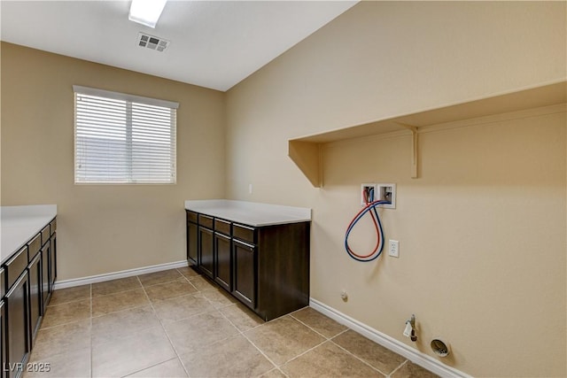 4208 Falcons Flight Ave, North Las Vegas, NV 89084 - laundry room featuring washer hookup, hookup for a gas dryer, light tile patterned floors, and cabinet space
