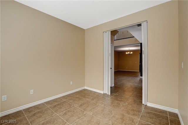 4208 Falcons Flight Ave, North Las Vegas, NV 89084 - spare room featuring tile patterned flooring and a chandelier