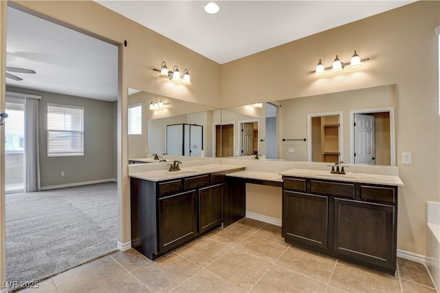 4208 Falcons Flight Ave, North Las Vegas, NV 89084 - full bath with double vanity, tile patterned floors, and a ceiling fan