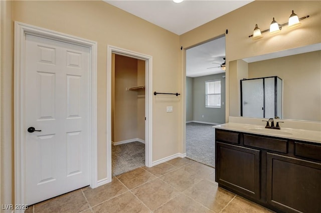 4208 Falcons Flight Ave, North Las Vegas, NV 89084 - full bathroom featuring vanity, a ceiling fan, tile patterned flooring, and a shower