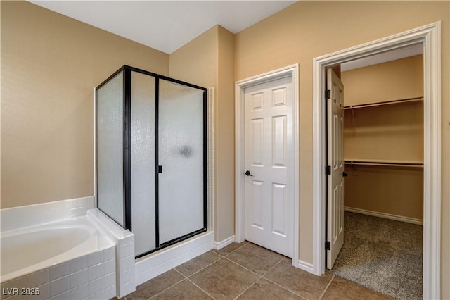 4208 Falcons Flight Ave, North Las Vegas, NV 89084 - full bath with a stall shower, a bath, a walk in closet, and tile patterned flooring