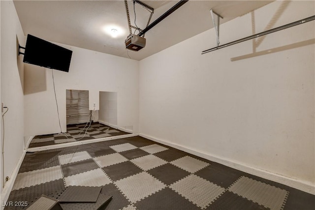 4208 Falcons Flight Ave, North Las Vegas, NV 89084 - garage featuring a garage door opener and baseboards