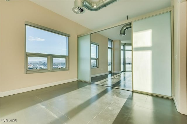 200 Hoover Ave Unit 903, Las Vegas, NV 89101 - unfurnished room with concrete floors and baseboards