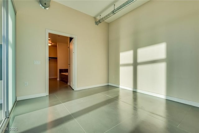 200 Hoover Ave Unit 903, Las Vegas, NV 89101 - spare room featuring finished concrete floors and baseboards