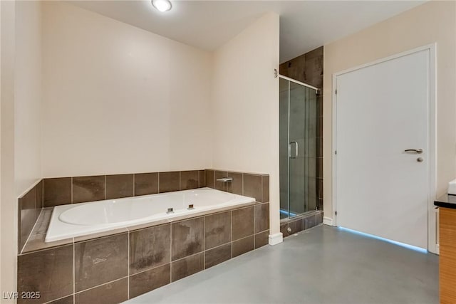 200 Hoover Ave Unit 903, Las Vegas, NV 89101 - bathroom with a bath, a shower stall, and finished concrete floors