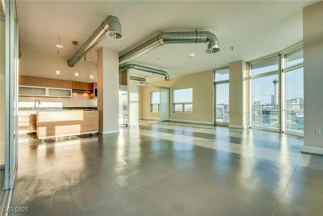 200 Hoover Ave Unit 903, Las Vegas, NV 89101 - garage featuring baseboards and a sink