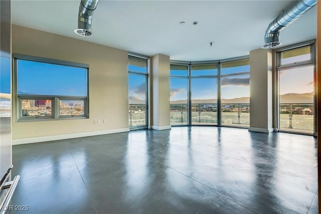 200 Hoover Ave Unit 903, Las Vegas, NV 89101 - spare room featuring plenty of natural light, concrete floors, and expansive windows
