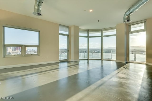 200 Hoover Ave Unit 903, Las Vegas, NV 89101 - empty room featuring concrete flooring, healthy amount of natural light, and a wall of windows