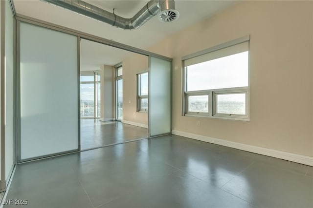 200 Hoover Ave Unit 903, Las Vegas, NV 89101 - unfurnished room featuring concrete floors and healthy amount of natural light