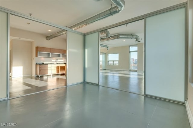 200 Hoover Ave Unit 903, Las Vegas, NV 89101 - garage with a sink and baseboards