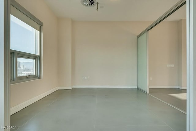 200 Hoover Ave Unit 903, Las Vegas, NV 89101 - spare room featuring concrete floors and baseboards