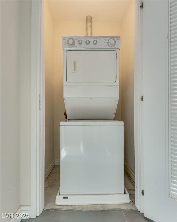 200 Hoover Ave Unit 903, Las Vegas, NV 89101 - washroom featuring stacked washer / drying machine and baseboards