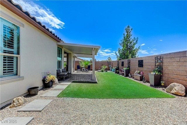 3605 Greenbriar Bluff Ave, North Las Vegas, NV 89081 - fenced backyard with a patio