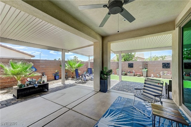 3605 Greenbriar Bluff Ave, North Las Vegas, NV 89081 - fenced backyard with a ceiling fan and a patio area