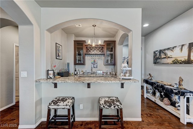 3605 Greenbriar Bluff Ave, North Las Vegas, NV 89081 - indoor dry bar with decorative light fixtures, dark wood-style floors, a chandelier, and recessed lighting