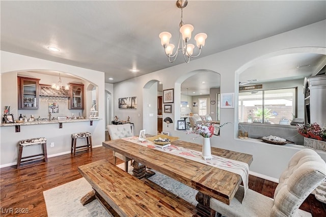 3605 Greenbriar Bluff Ave, North Las Vegas, NV 89081 - dining room with a chandelier, dark wood-type flooring, arched walkways, and recessed lighting