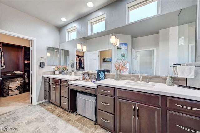 3605 Greenbriar Bluff Ave, North Las Vegas, NV 89081 - bathroom featuring a walk in closet, vanity, and a high ceiling