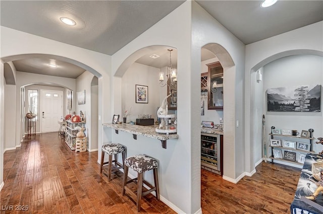3605 Greenbriar Bluff Ave, North Las Vegas, NV 89081 - hall featuring wine cooler and dark wood-style flooring