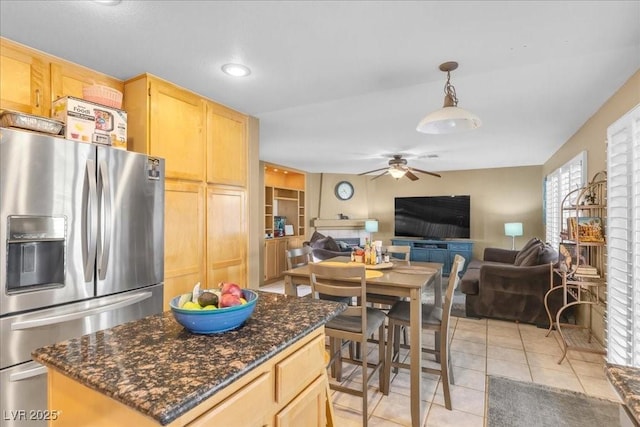 9836 La Vid Ct, Las Vegas, NV 89117 - kitchen featuring stainless steel refrigerator with ice dispenser, open floor plan, light brown cabinetry, and recessed lighting