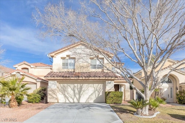 9836 La Vid Ct, Las Vegas, NV 89117 - view of front of home featuring concrete driveway, stucco siding, a tiled roof, and an attached garage