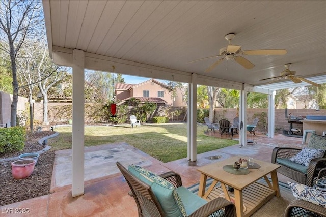 9836 La Vid Ct, Las Vegas, NV 89117 - fenced backyard featuring a patio area, an outdoor living space, and a ceiling fan