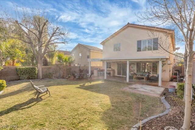 9836 La Vid Ct, Las Vegas, NV 89117 - back of property with a fenced backyard, a patio, stucco siding, and a tiled roof