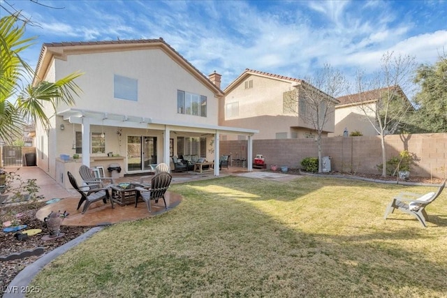 9836 La Vid Ct, Las Vegas, NV 89117 - rear view of property featuring a patio, an outdoor living space with a fire pit, stucco siding, and a chimney