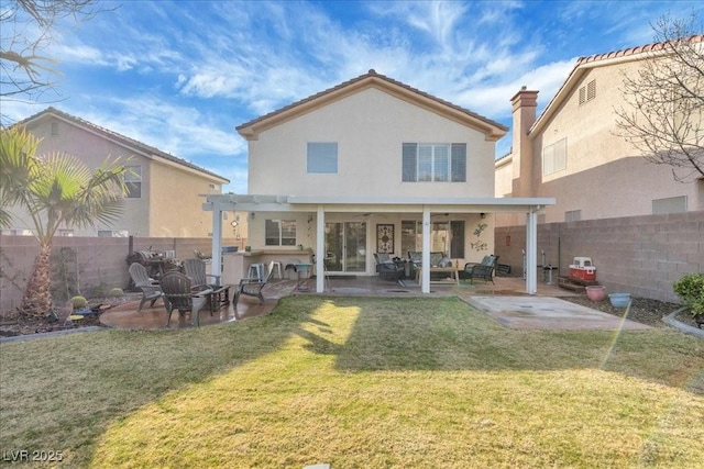 9836 La Vid Ct, Las Vegas, NV 89117 - rear view of property featuring a fenced backyard, a patio area, stucco siding, and a fire pit