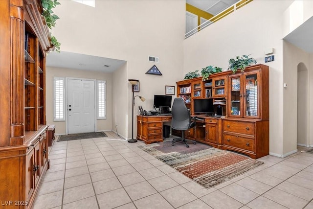9836 La Vid Ct, Las Vegas, NV 89117 - office area featuring a high ceiling, light tile patterned floors, and arched walkways