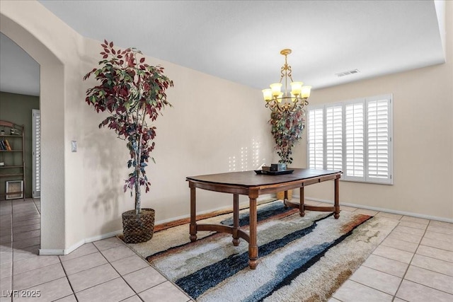 9836 La Vid Ct, Las Vegas, NV 89117 - dining area featuring tile patterned floors, a chandelier, and arched walkways