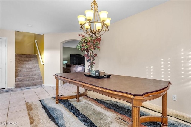 9836 La Vid Ct, Las Vegas, NV 89117 - dining room featuring arched walkways, light tile patterned flooring, a chandelier, and stairs