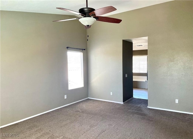 164 Swale Ln, Las Vegas, NV 89144 - unfurnished room featuring plenty of natural light, a ceiling fan, and dark colored carpet