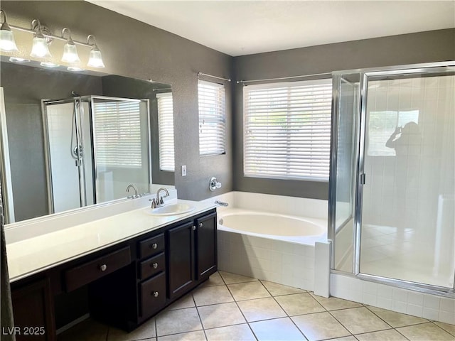 164 Swale Ln, Las Vegas, NV 89144 - full bathroom featuring vanity, a garden tub, a stall shower, and tile patterned floors