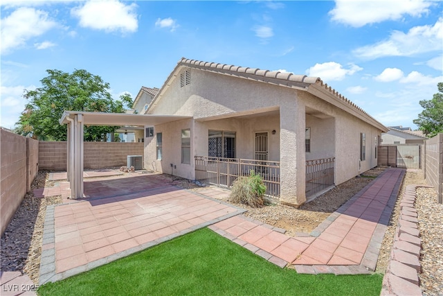1205 Boulder Shore Ave, North Las Vegas, NV 89081 - rear view of house featuring a patio area, a fenced backyard, and stucco siding