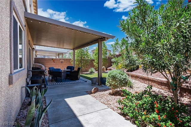 7009 Judith River St, North Las Vegas, NV 89084 - fenced backyard featuring a patio area and outdoor lounge area