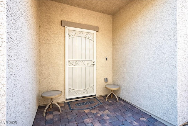 7009 Judith River St, North Las Vegas, NV 89084 - view of exterior entry featuring stucco siding
