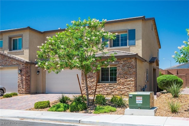 7009 Judith River St, North Las Vegas, NV 89084 - view of front of house with stone siding, stucco siding, and driveway