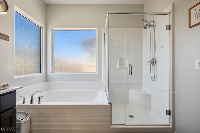 7009 Judith River St, North Las Vegas, NV 89084 - bathroom featuring a shower stall, a bath, and vanity