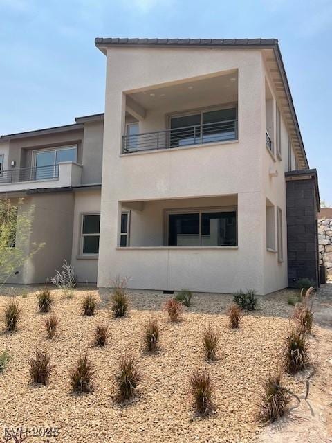 11442 Crimson Ledge Ave, Las Vegas, NV 89138 - back of property with stucco siding and a balcony