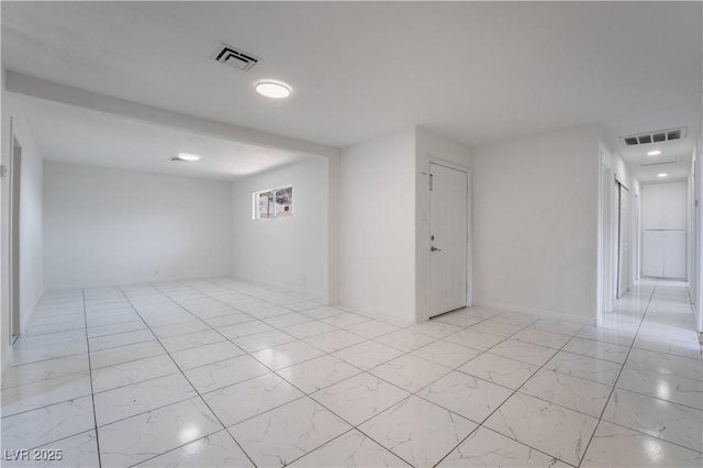 5317 Lytton Ave, Las Vegas, NV 89146 - empty room with light marble finish flooring and recessed lighting